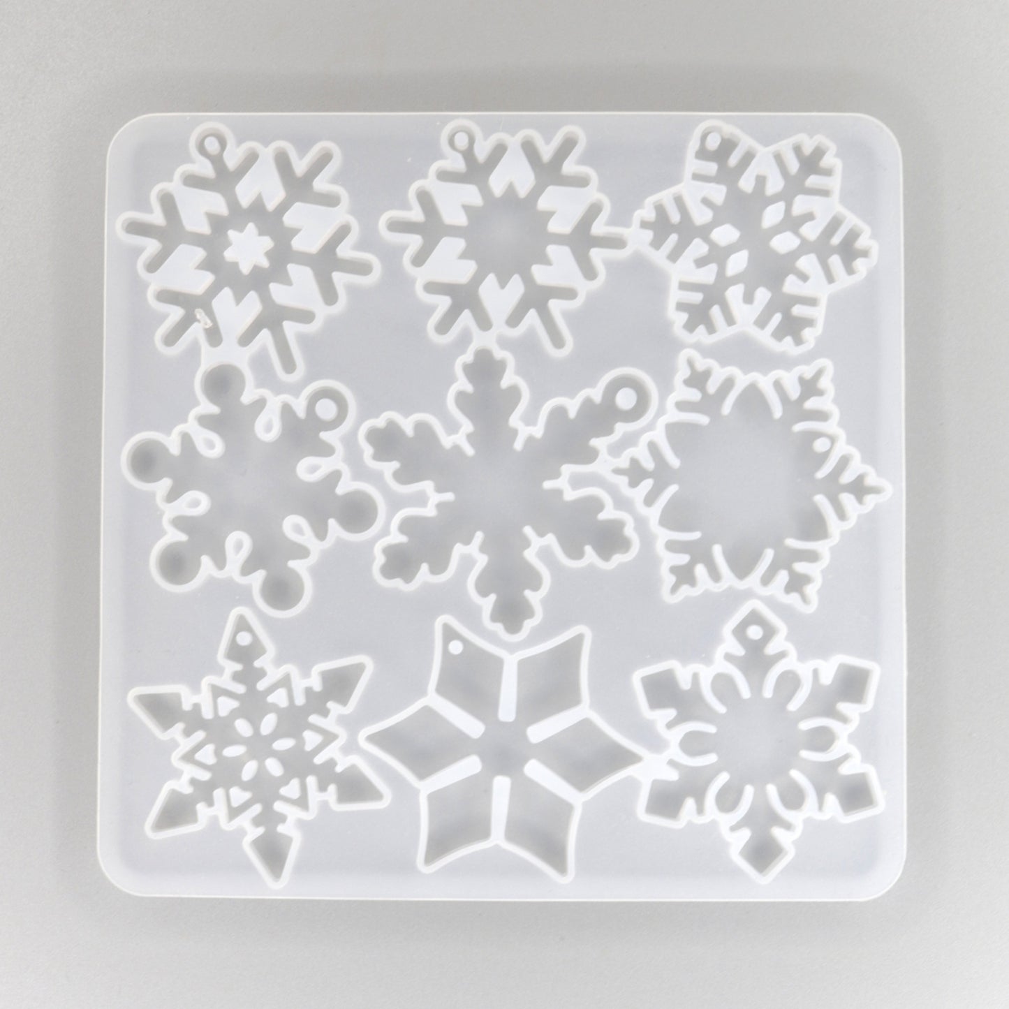 Silikonform mit 12 verschieden Schneeflocken Anhänger 