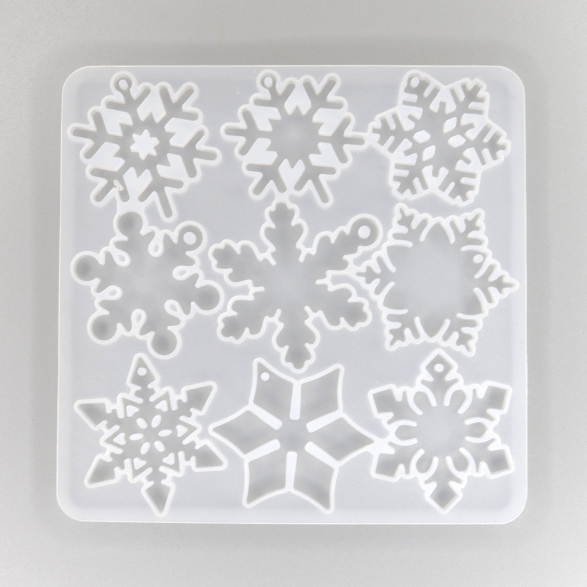 Silikonform mit 12 verschieden Schneeflocken Anhänger 