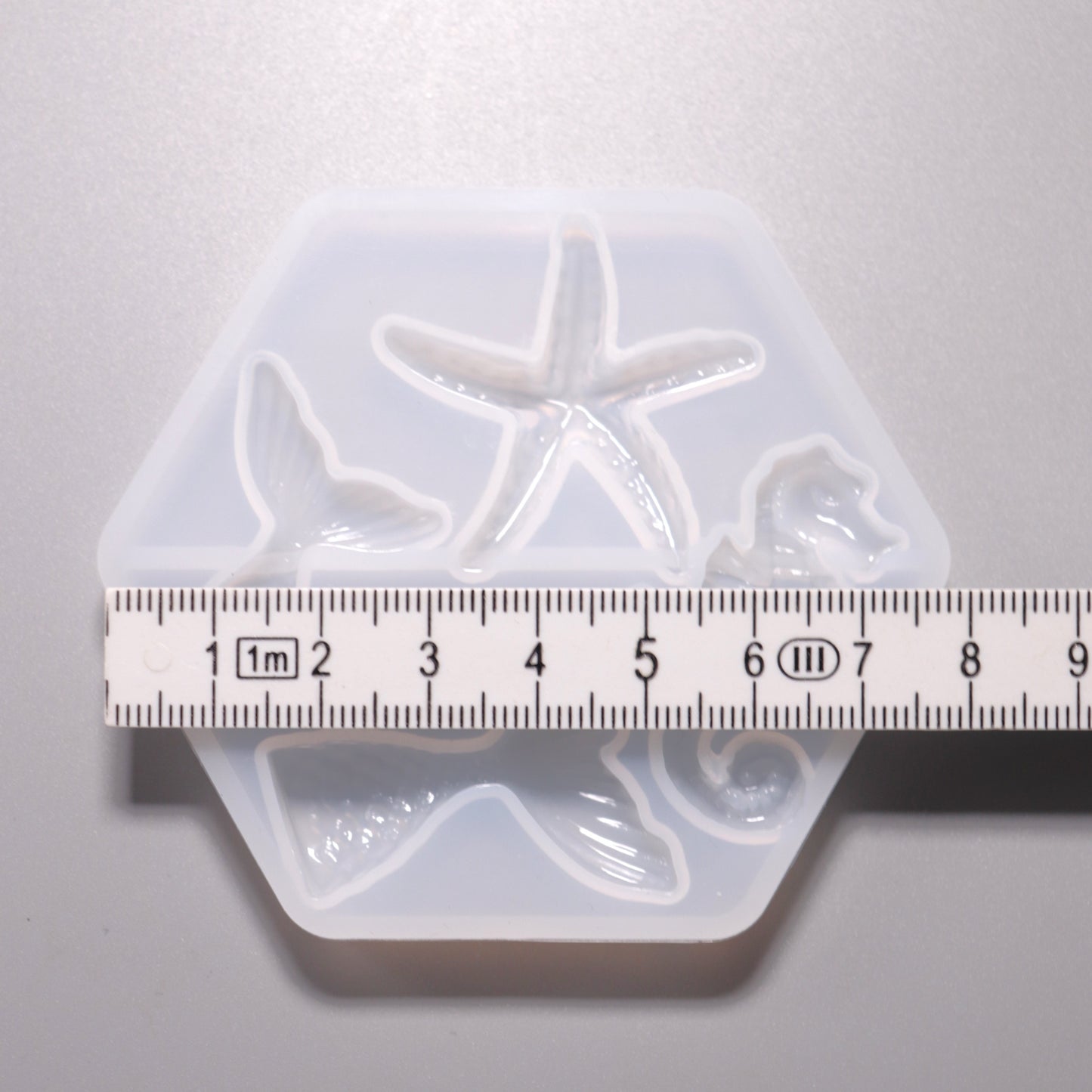 Silikon Gießform Seepferdchen, Seestern, Fischflossen ca. 2 bis 4 cm. Ansicht mit Lineal.