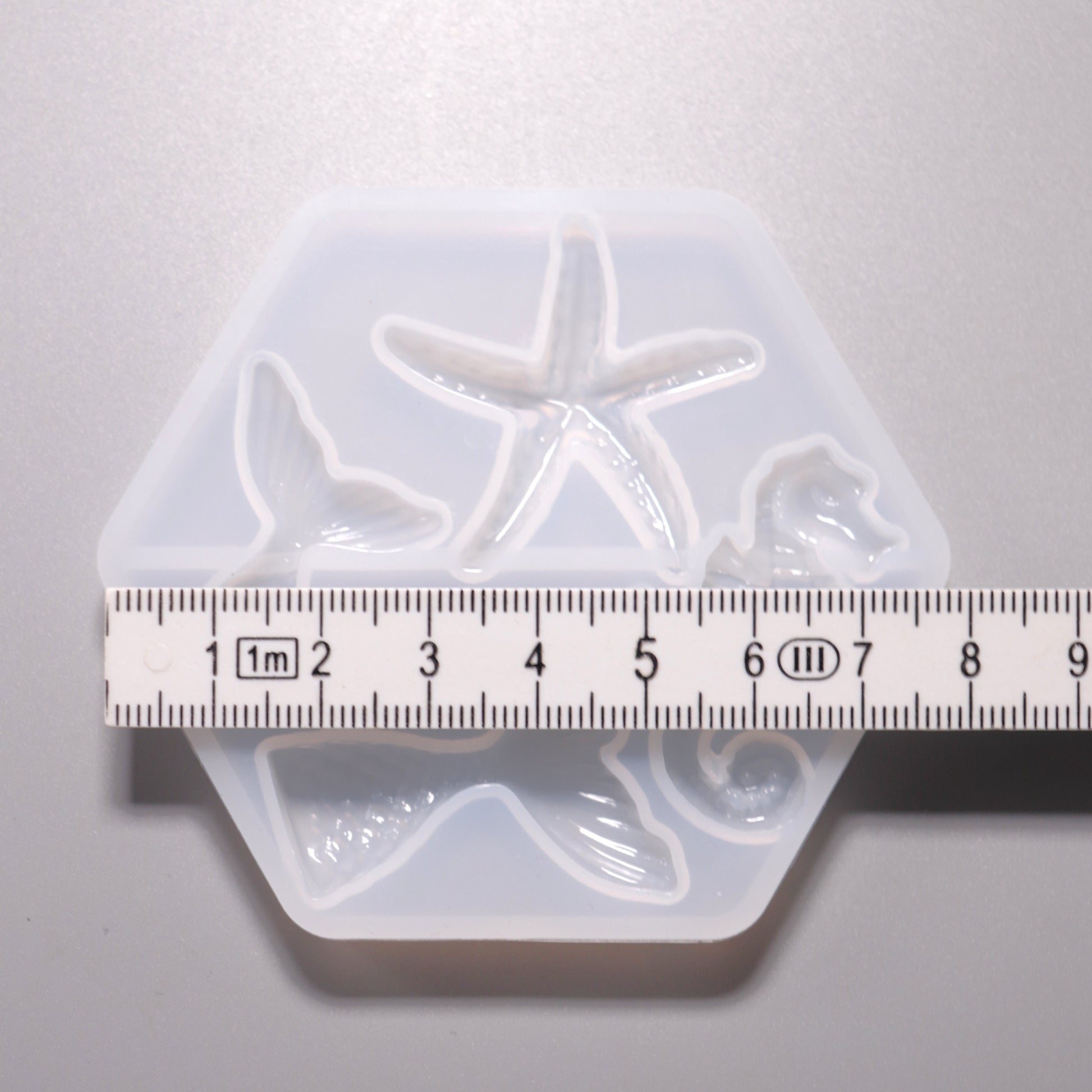 Silikon Gießform Seepferdchen, Seestern, Fischflossen ca. 2 bis 4 cm. Ansicht mit Lineal.