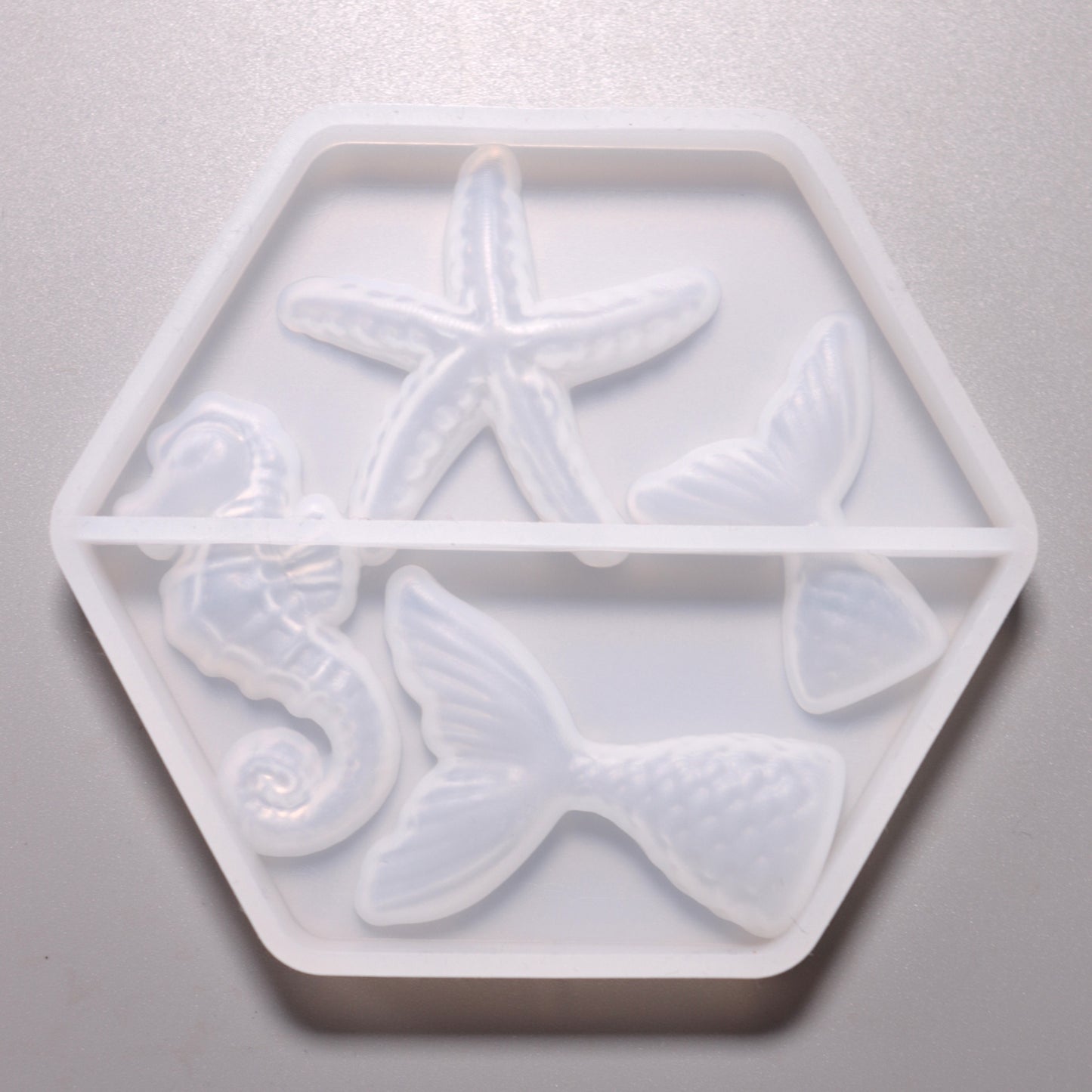 Silikon Gießform Seepferdchen, Seestern, Fischflossen ca. 2 bis 4 cm. Rückseite.